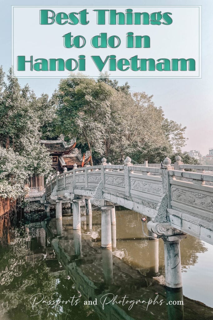 A white bridge over water leading to a temple in Hanoi Vietnam - Things to do in Hanoi