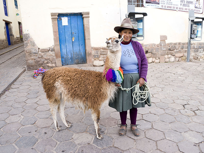 Woman with her llama in Cusco Peru - things to do in Cusco