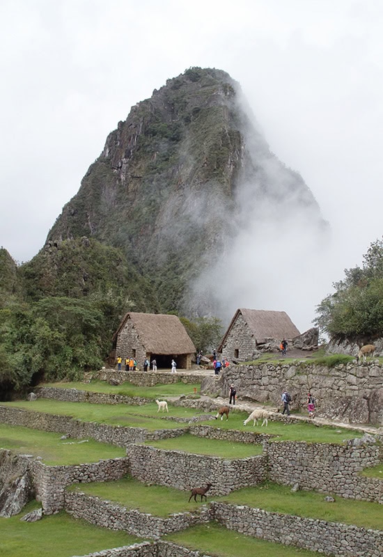 Huayna Picchu Mountain surrounded by clouds at Machu Picchu
